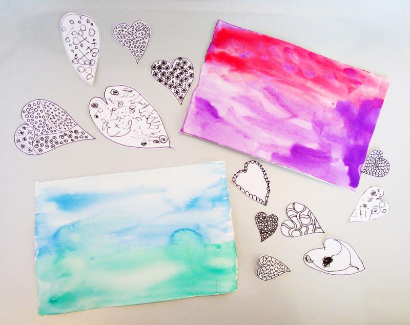 Heart cut outs and watercolour paintings.