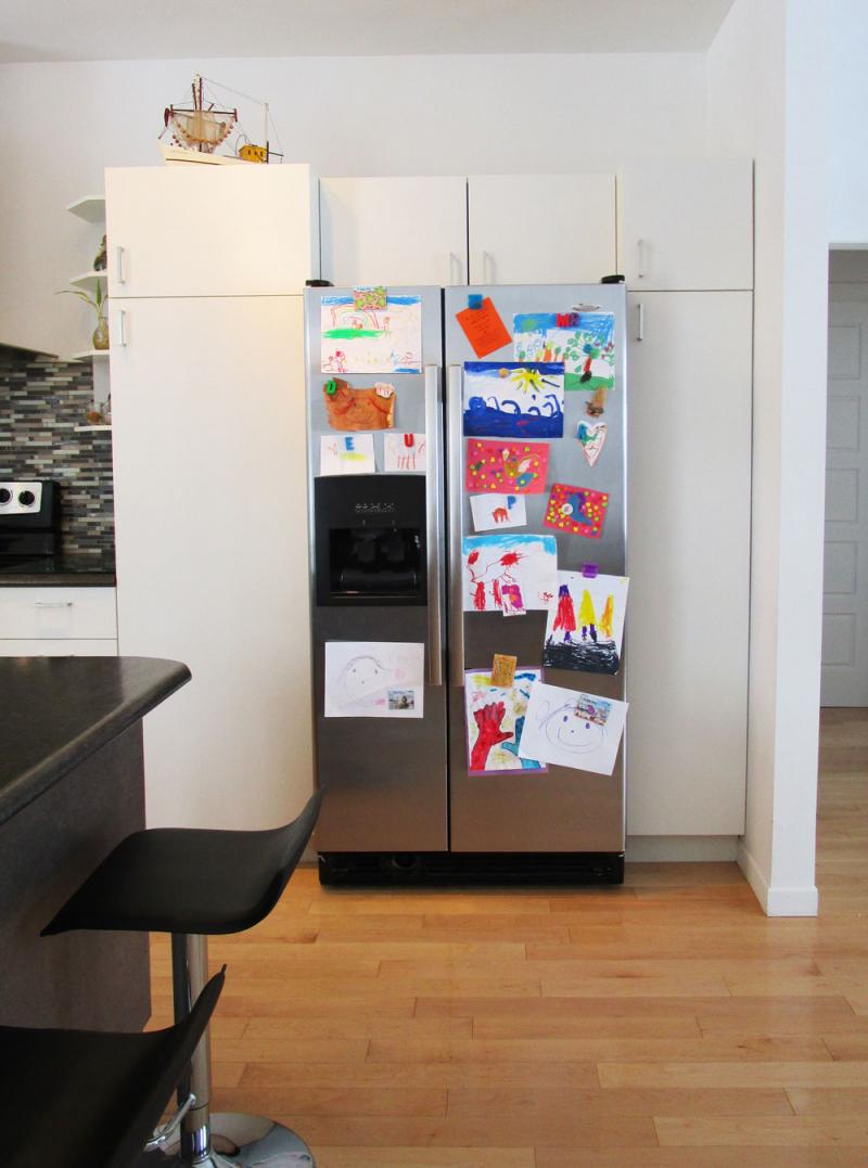A fridge full of kid's art.