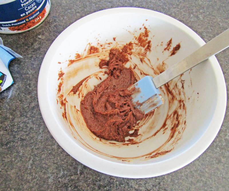 Mixing chocolate butter in a bowl.