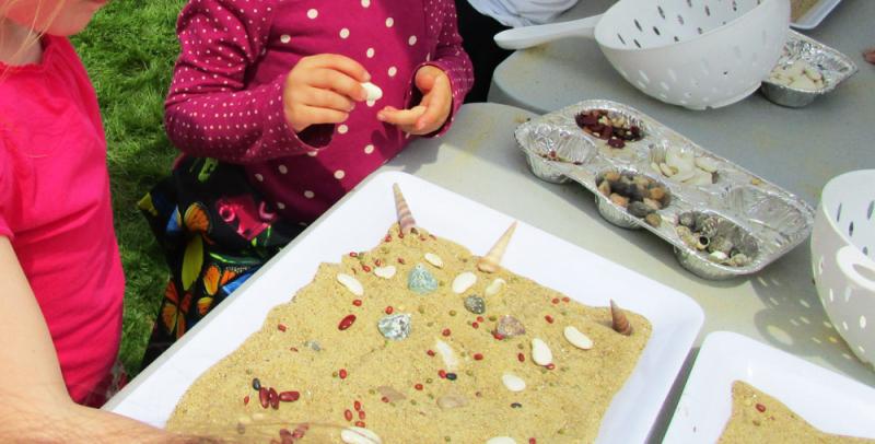 Kids can make temporary mosaics with sand.