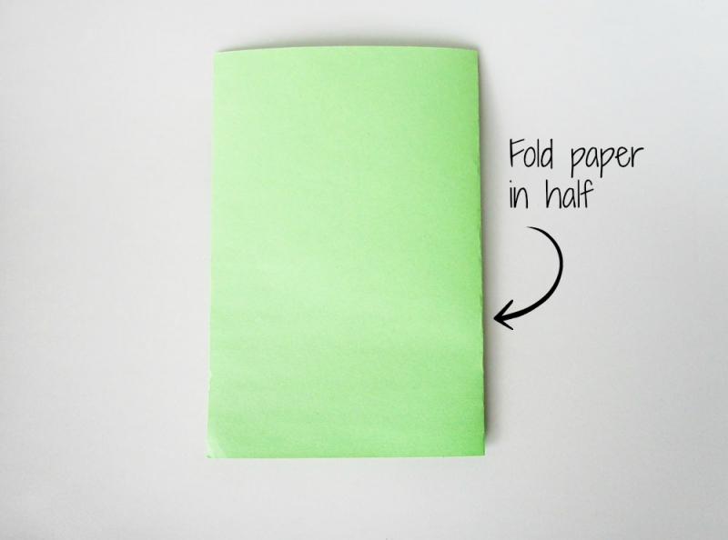 Fold the construction paper in half.