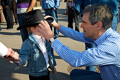 Michael Ignatieff fixes a child's hat at the Calgary Stampede