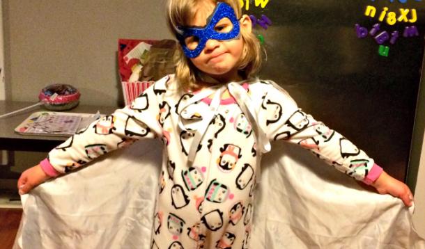 Little girl dressed as a superhero