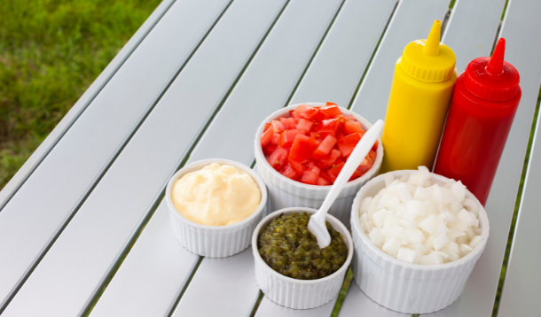 table with summer bbq condiments