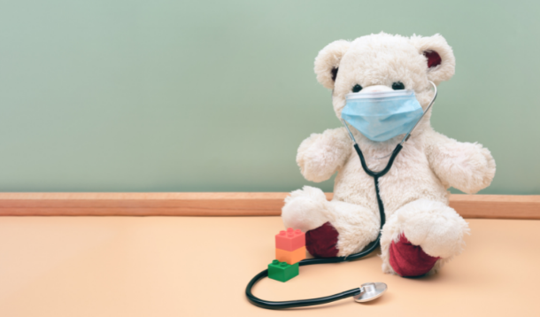 teddy bear wearing a medical mask