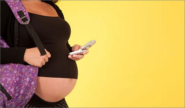 Pregnant woman with phone