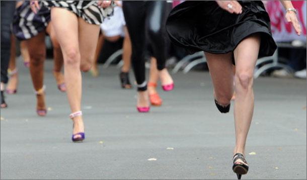 women running in high heels