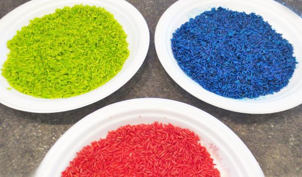 Sure, rainbow rice is fantastic when it comes to sensory play, and games but it is also a terrific material to use when creating works of art.