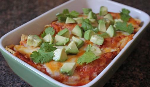 Turn a store-bought rotisserie chicken into this Easy Cheesy Chicken Enchiladas recipe for a tasty Mexican meal for the Super Bowl... or any occasion! | YMC | YummyMummyClub.ca