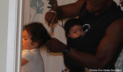 daddy blogger doing childs hair