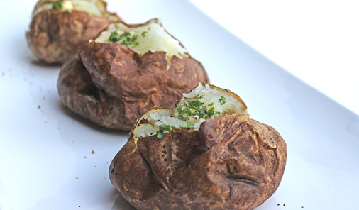 This chef-tested trick gives baked potatoes a tasty crispy skin and fluffier inside. Make this easy recipe for the perfect BBQ side dish everytime.| YMC