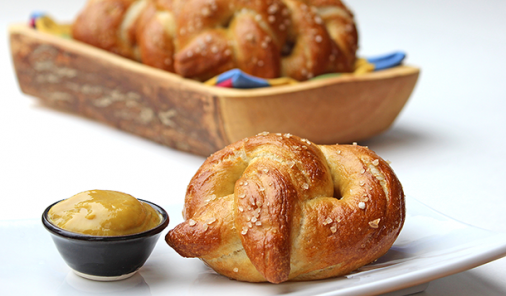 Soft, chewy and delicious, these classic soft baked pretzels are fantastic on their own, and would also make amazing burger or sandwich buns. A great way to introduce your kids to working with yeast! | YMC