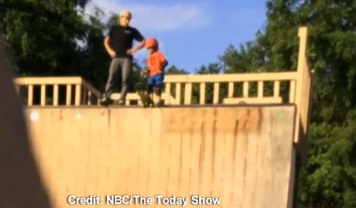 skateboard kid gets pushed down ramp