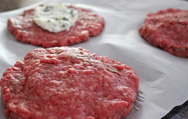 My family loves biting into the burger and tasting the herbed cream cheese in the middle. You can make a big batch of these burgers in advance if you like; they freeze really well. | YMC