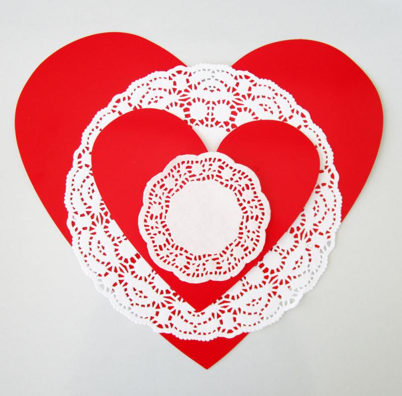 Layering doilies and heart cut-outs to make vintage Valentines. Easy activities for kids.