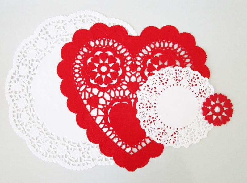 Layering doilies and heart cut-outs to make vintage Valentines. Easy activities for kids.