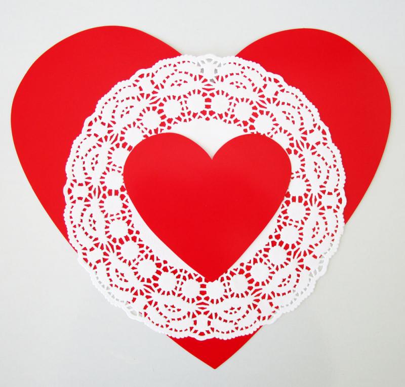 Layering doilies and heart cut-outs to make vintage Valentines. Easy activities for kids.